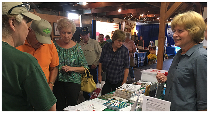 Senator Schwanks speaks with constituents at her booth at the Oley Fair