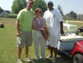 Senator Schwank presents a Senate citation congratulating Pittsburgh Steeler tight end John Gilmore, left, and Miami Dolphin quarterback Chad Henne, right, for the establishment by the two Berks athletes of the Gilmore/Henne Community Fund to improve local playgrounds with community-backed efforts during a project at Temple Playground on July 10.