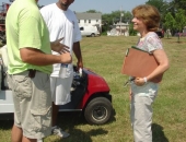 Senator Schwank presents a Senate citation congratulating Pittsburgh Steeler tight end John Gilmore, left, and Miami Dolphin quarterback Chad Henne, right, for the establishment by the two Berks athletes of the Gilmore/Henne Community Fund to improve local playgrounds with community-backed efforts during a project at Temple Playground on July 10.