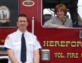 Senator Schwank presents Hereford Volunteer Fire Company with a state flag commemorating the housing.