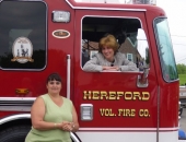 Senator Schwank presents Hereford Volunteer Fire Company with a state flag commemorating the housing.